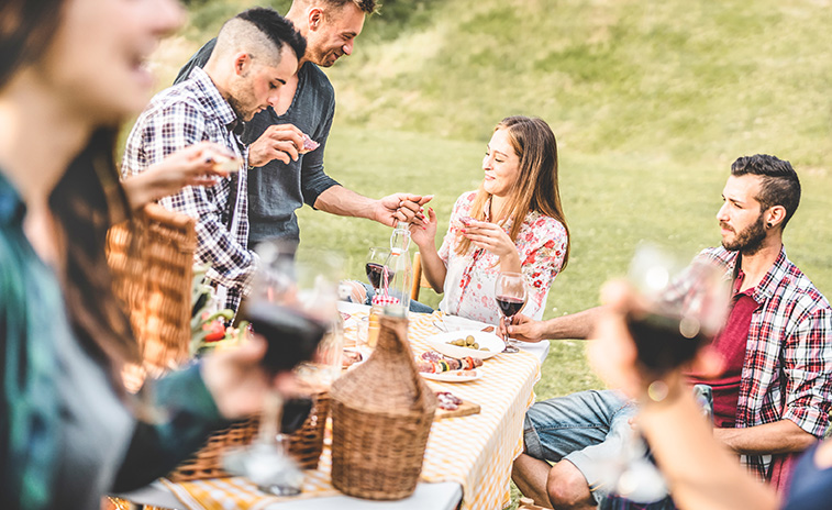 Group of people eating together outside