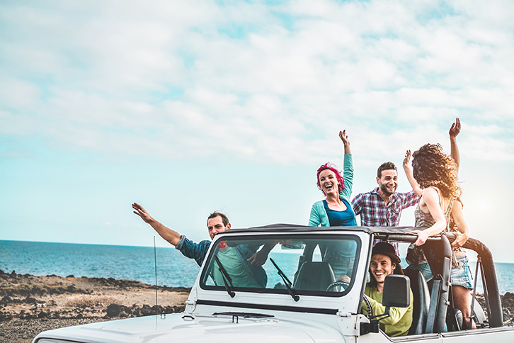 Group incentive trip. People laughing and enjoying themselves on a jeep